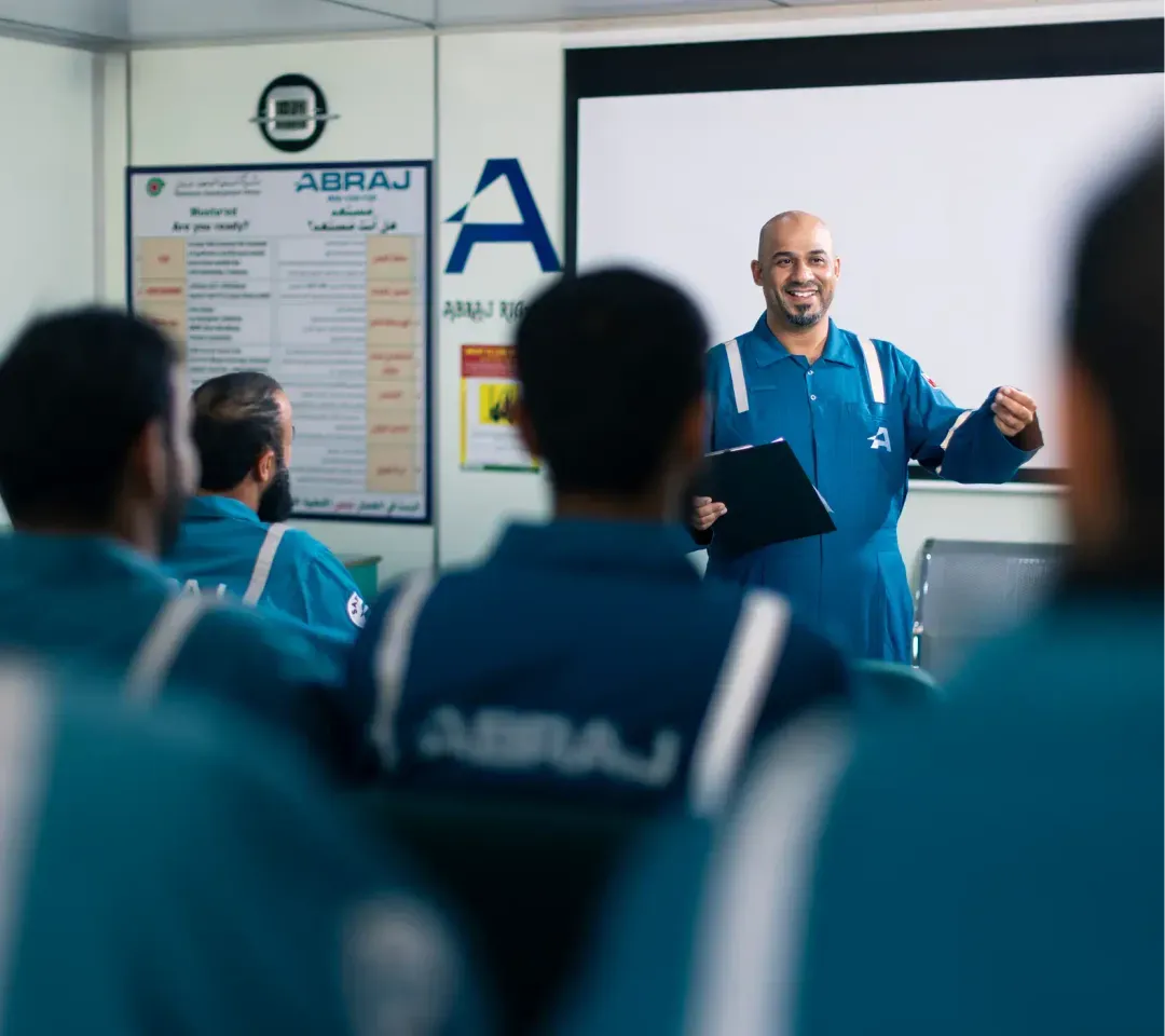 Engineers reviewing well planning and simulation screens in an ABRAJ technical centre